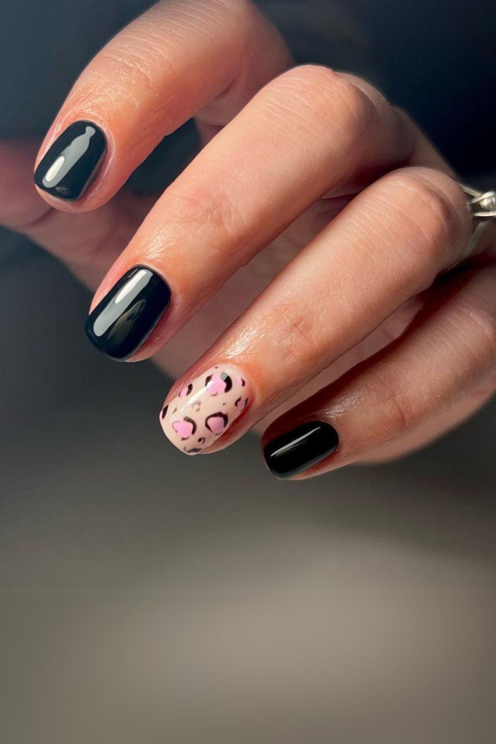 Black nails with leopard accent nails