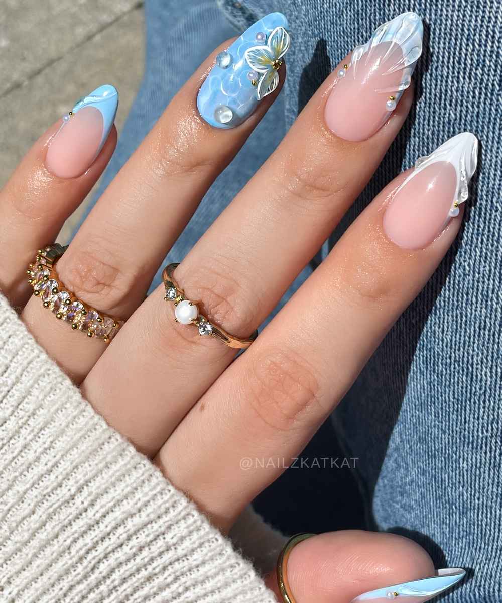 Blue and white nails with water ripple art and florals