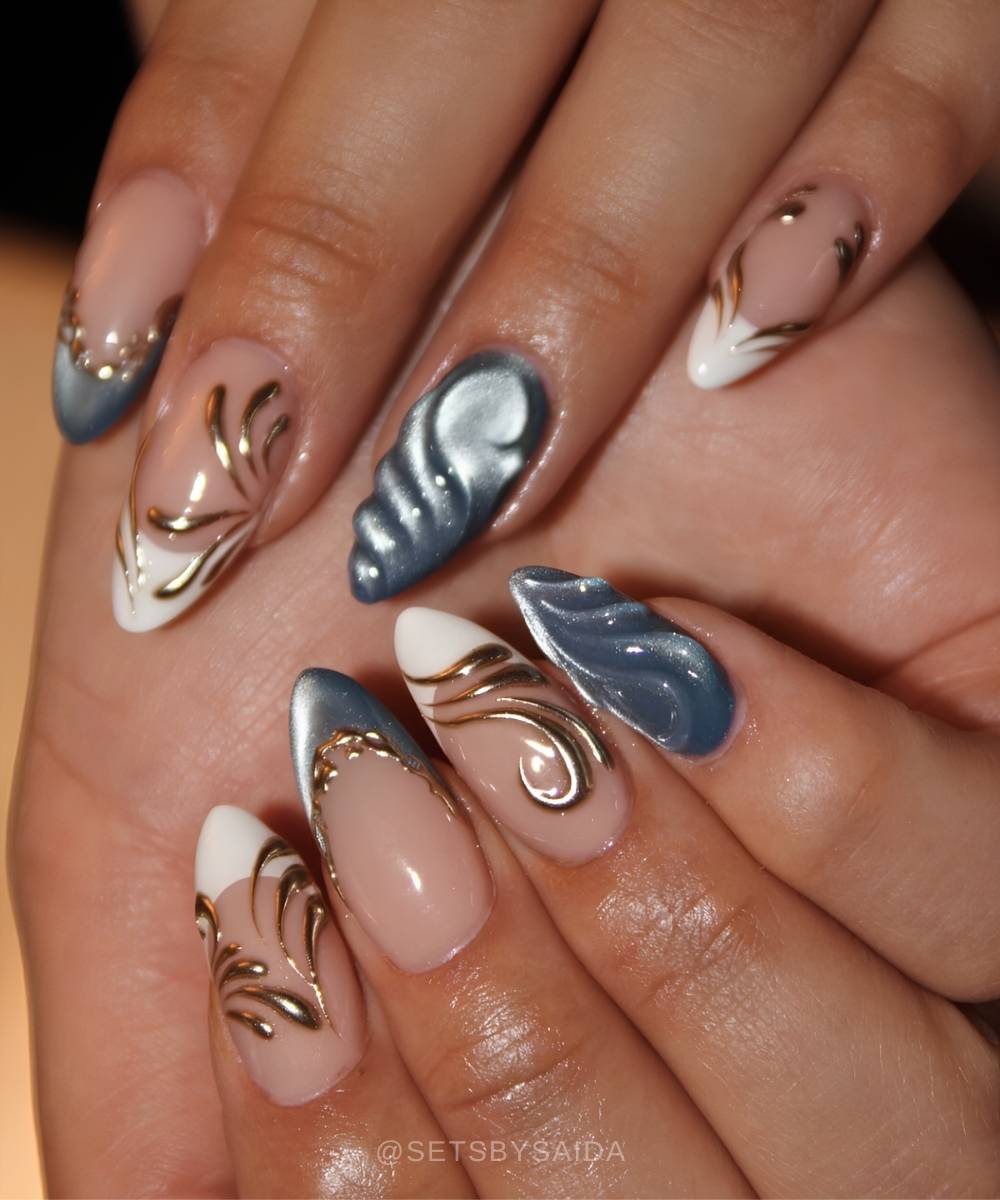 Blue cat eye nails with white and gold details