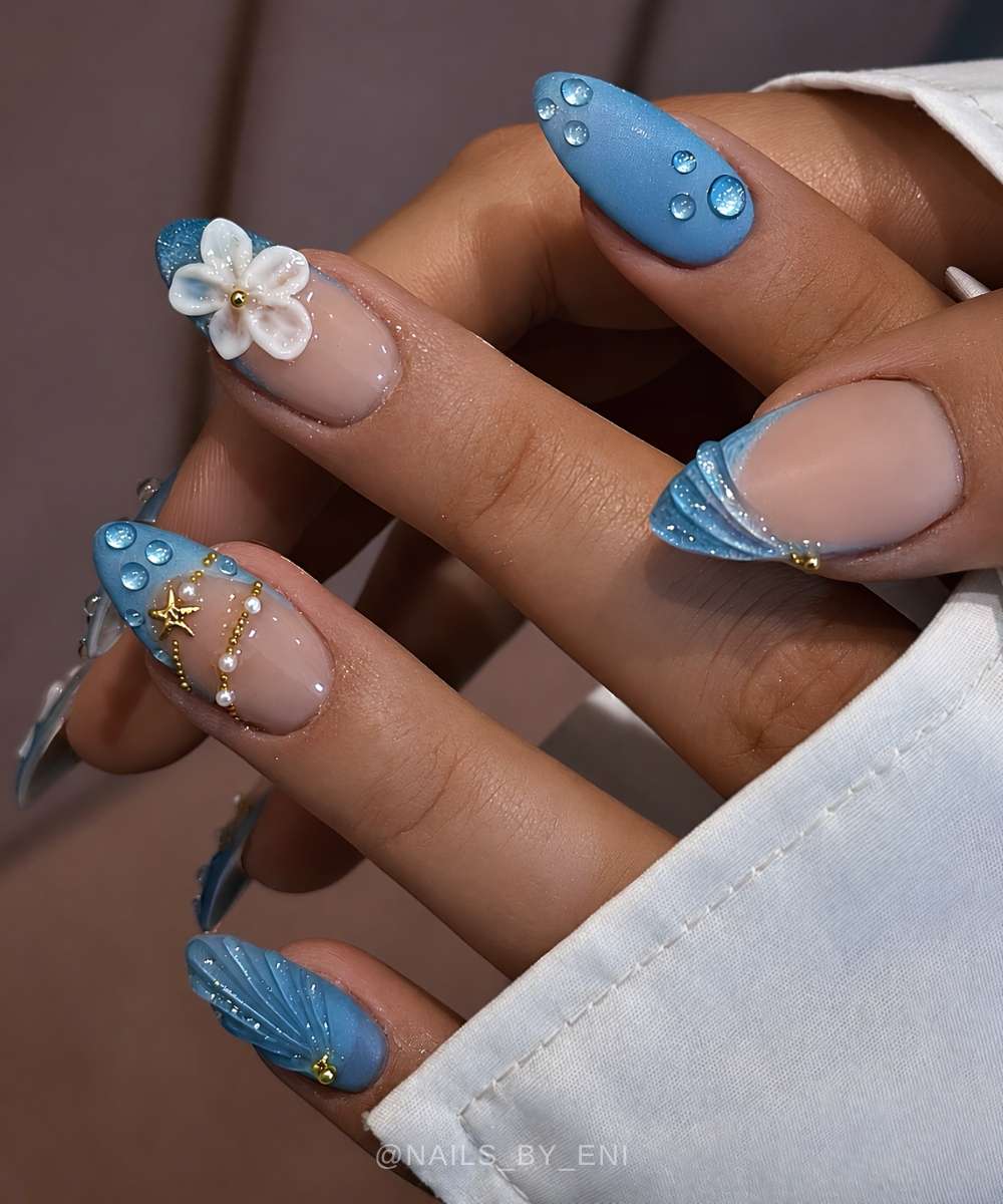 Blue matte nails with droplet art and ocean charms