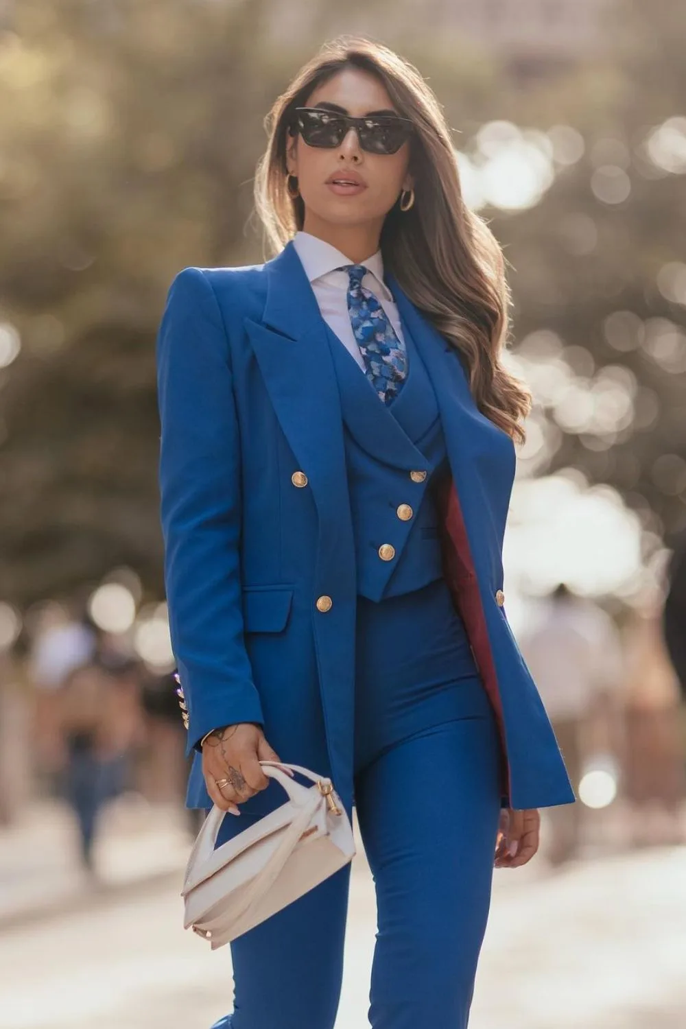 Blue suit with a patterned tie