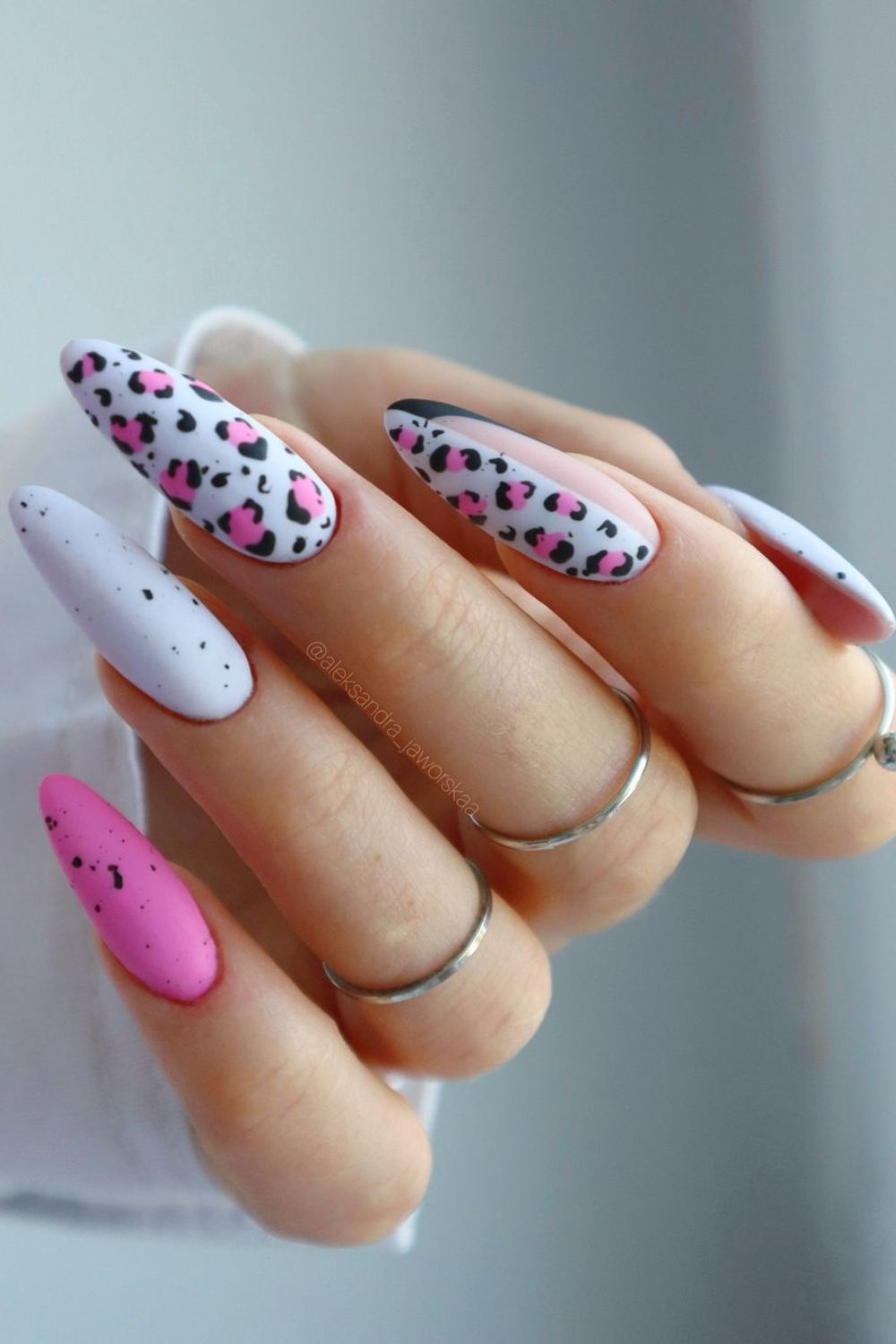 Bold pink and white leopard nails