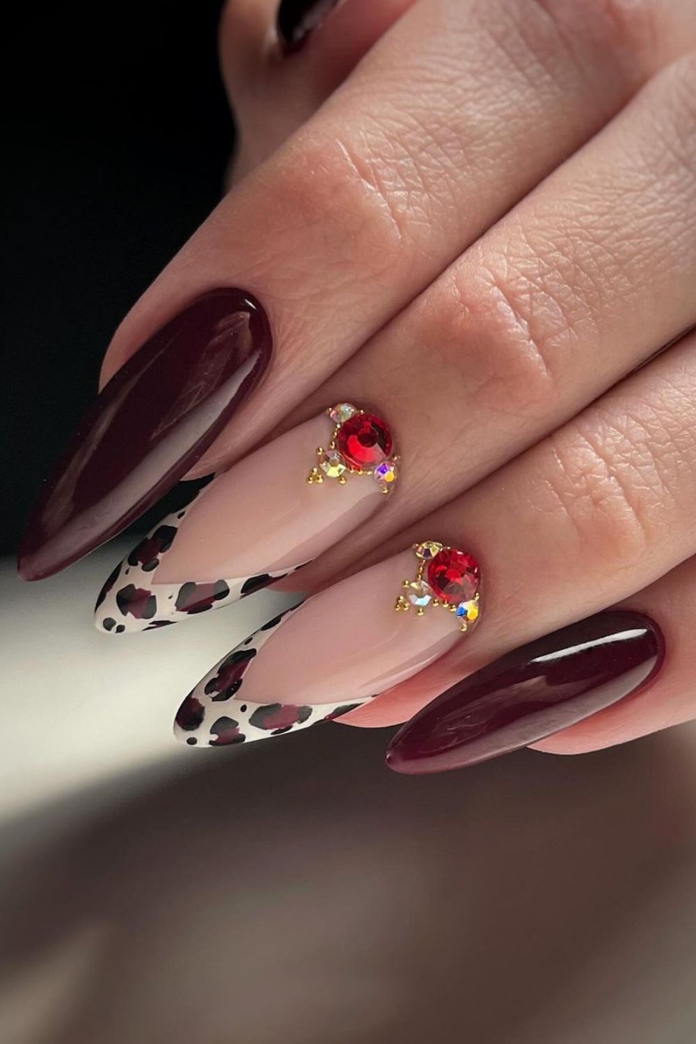 Burgundy nails with a leopard twist