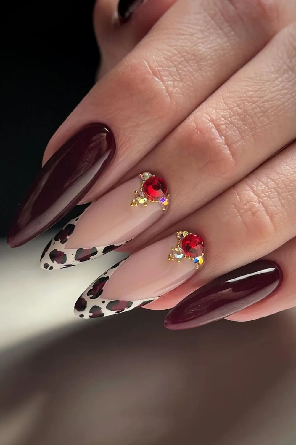 Burgundy nails with a leopard twist