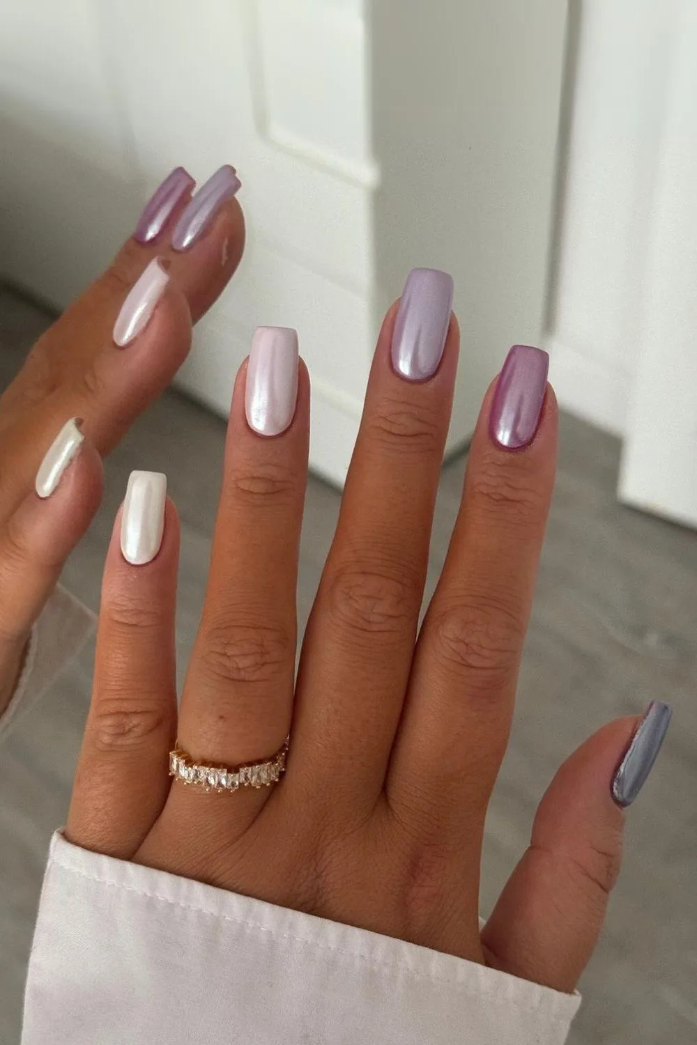 Chrome skittle nails in purple gradient colors