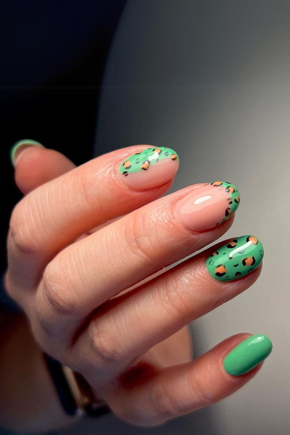 Green nails with leopard accents