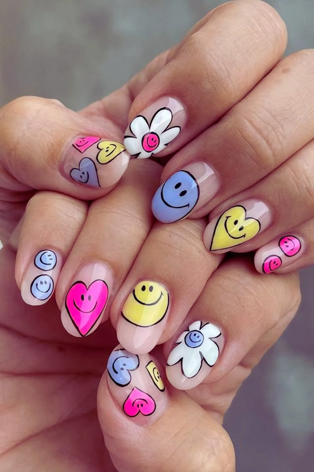 Happy nails with cartoon smileys and hearts