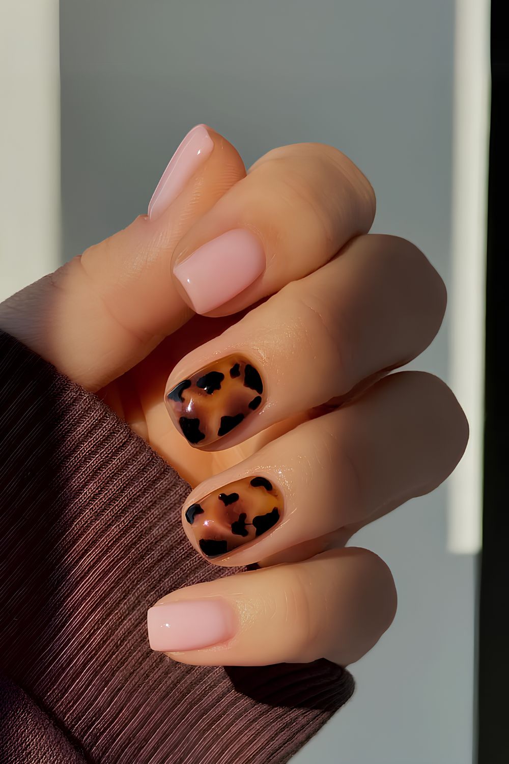 Milky pink mani with tortoise shell accents