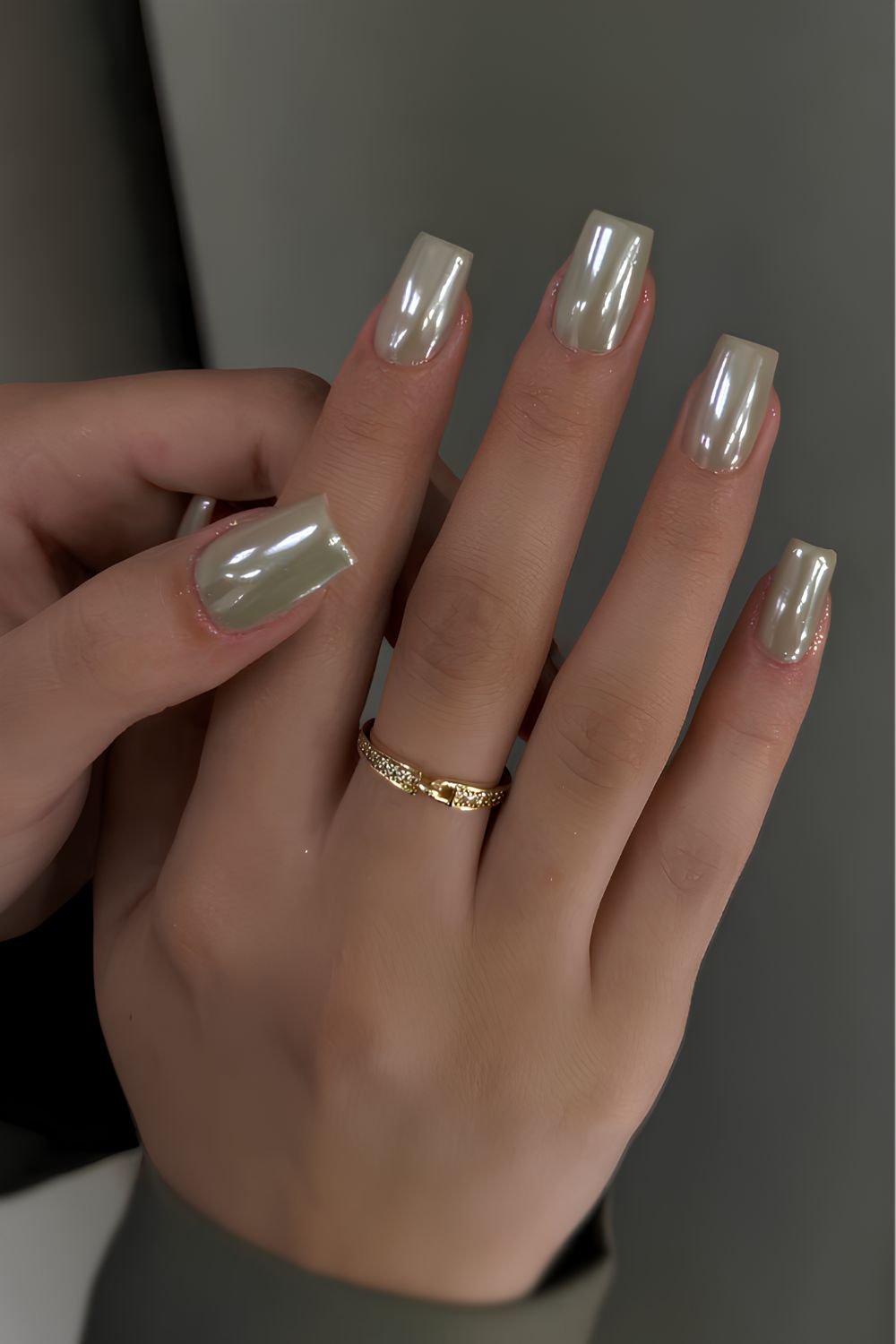 Muted light green chrome nails