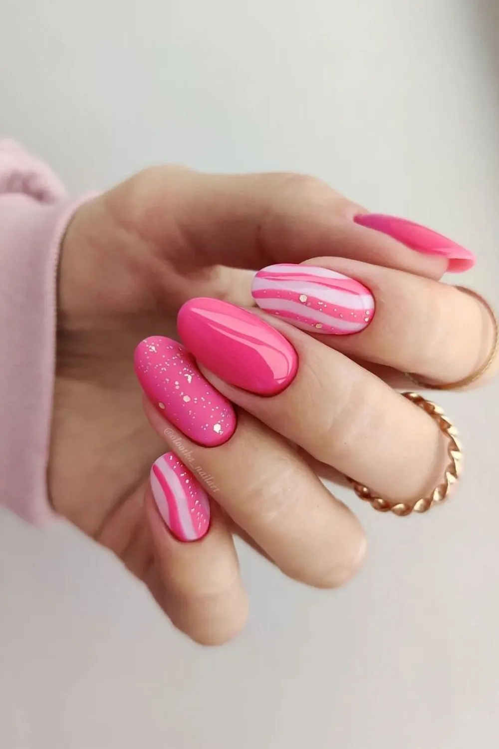 Nails with hot pink stripes and sparkles