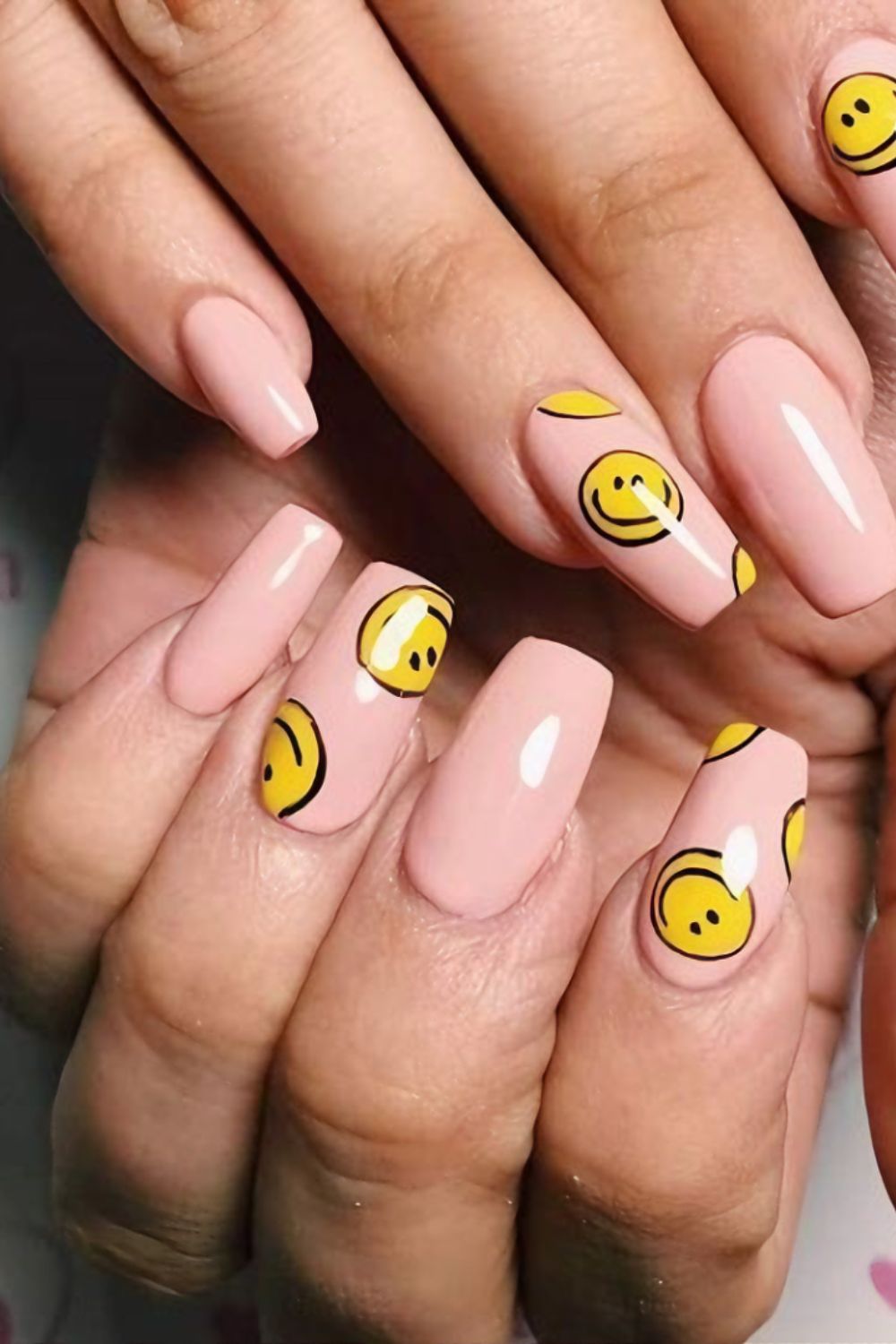 Nude nails with smiley faces