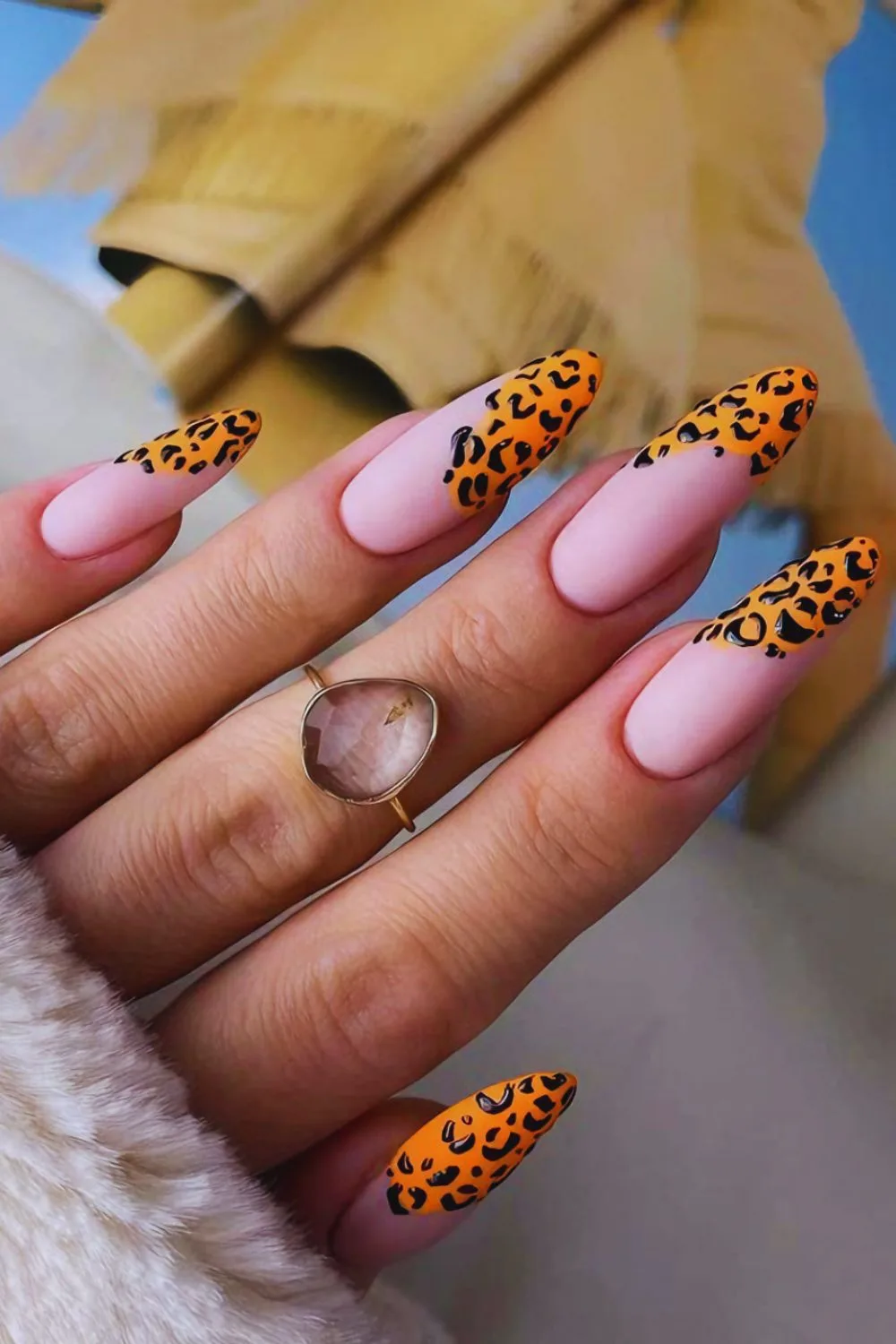 Orange-tipped leopard nails