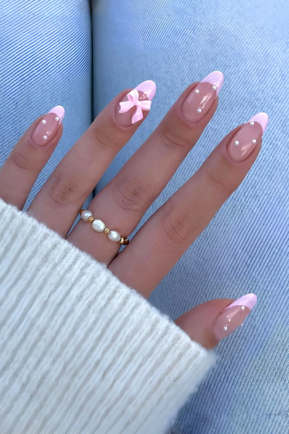 Pink French mani with pearls and 3D bows