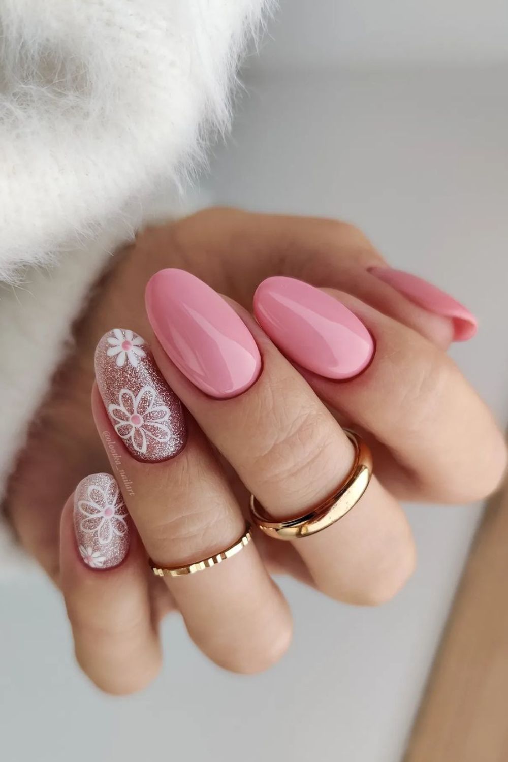 Pink nails with glittery floral accents