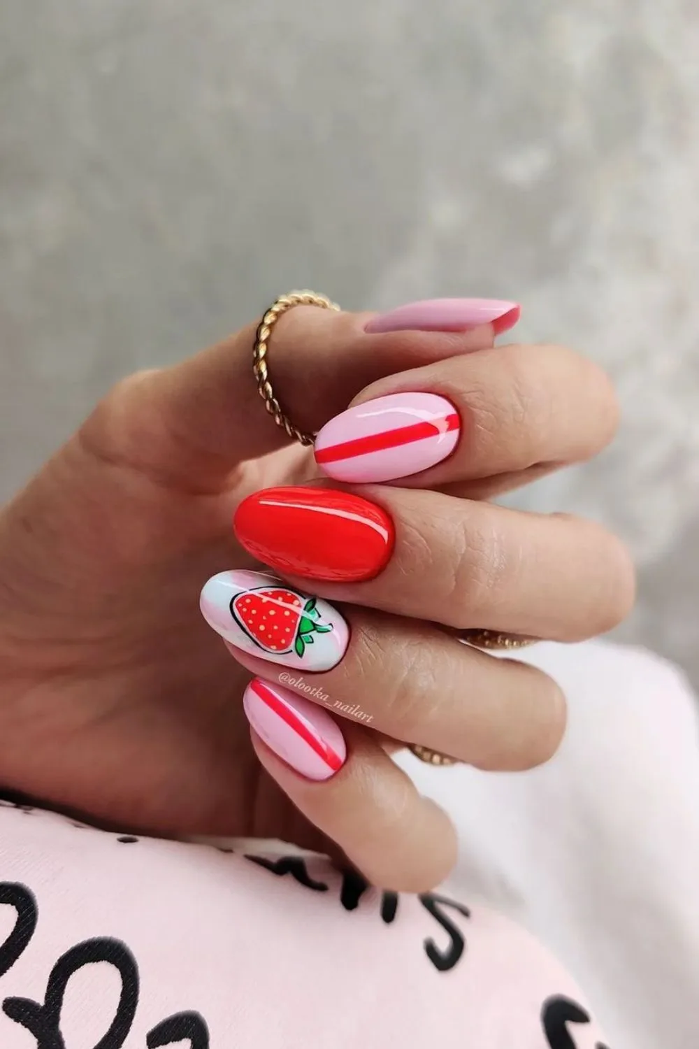 Pink nails with strawberries and stripes