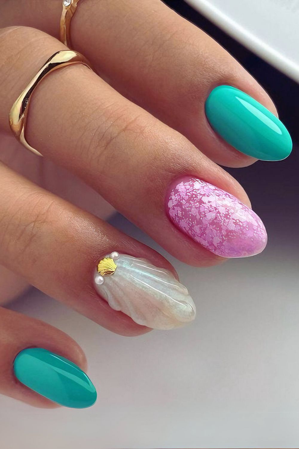 Pink and turquoise seashell nails