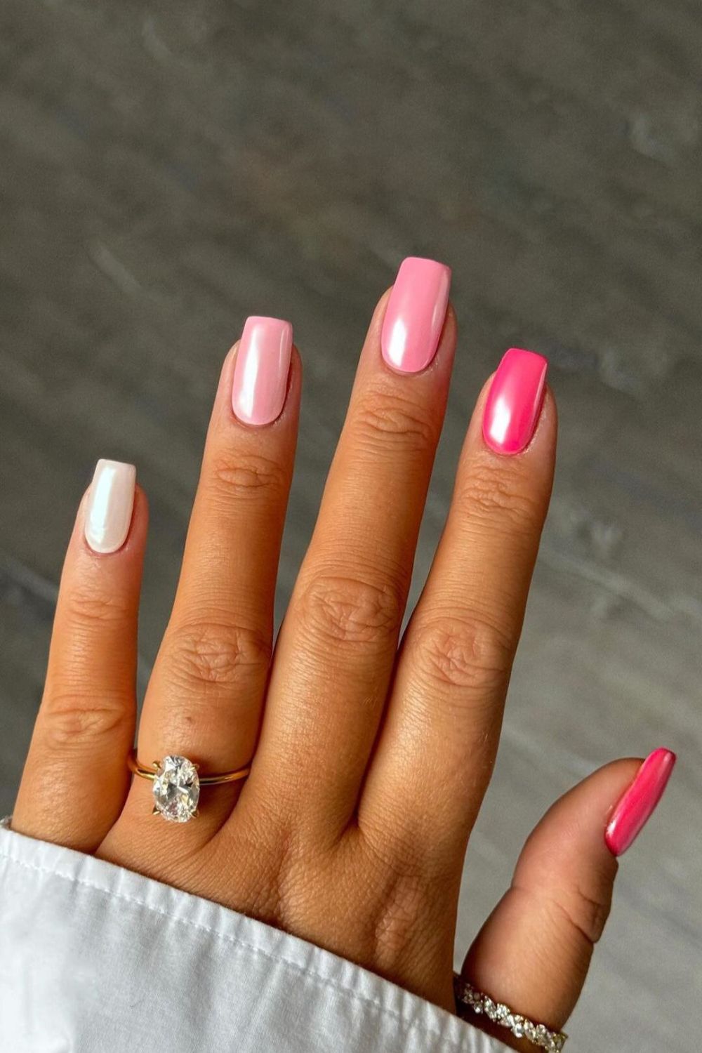 Pink skittle nails with chrome finish