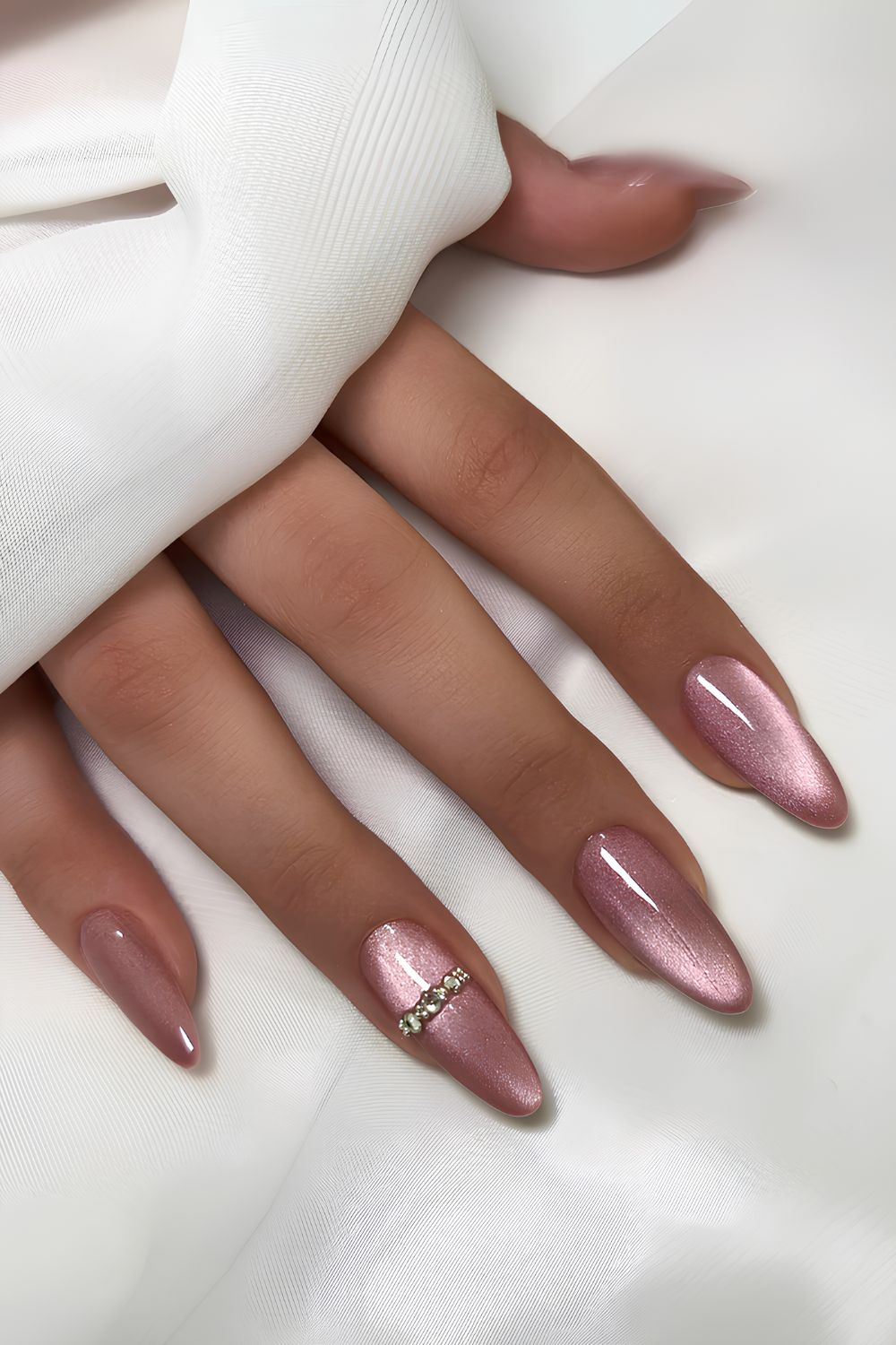 Pink velvet nails with gem accents