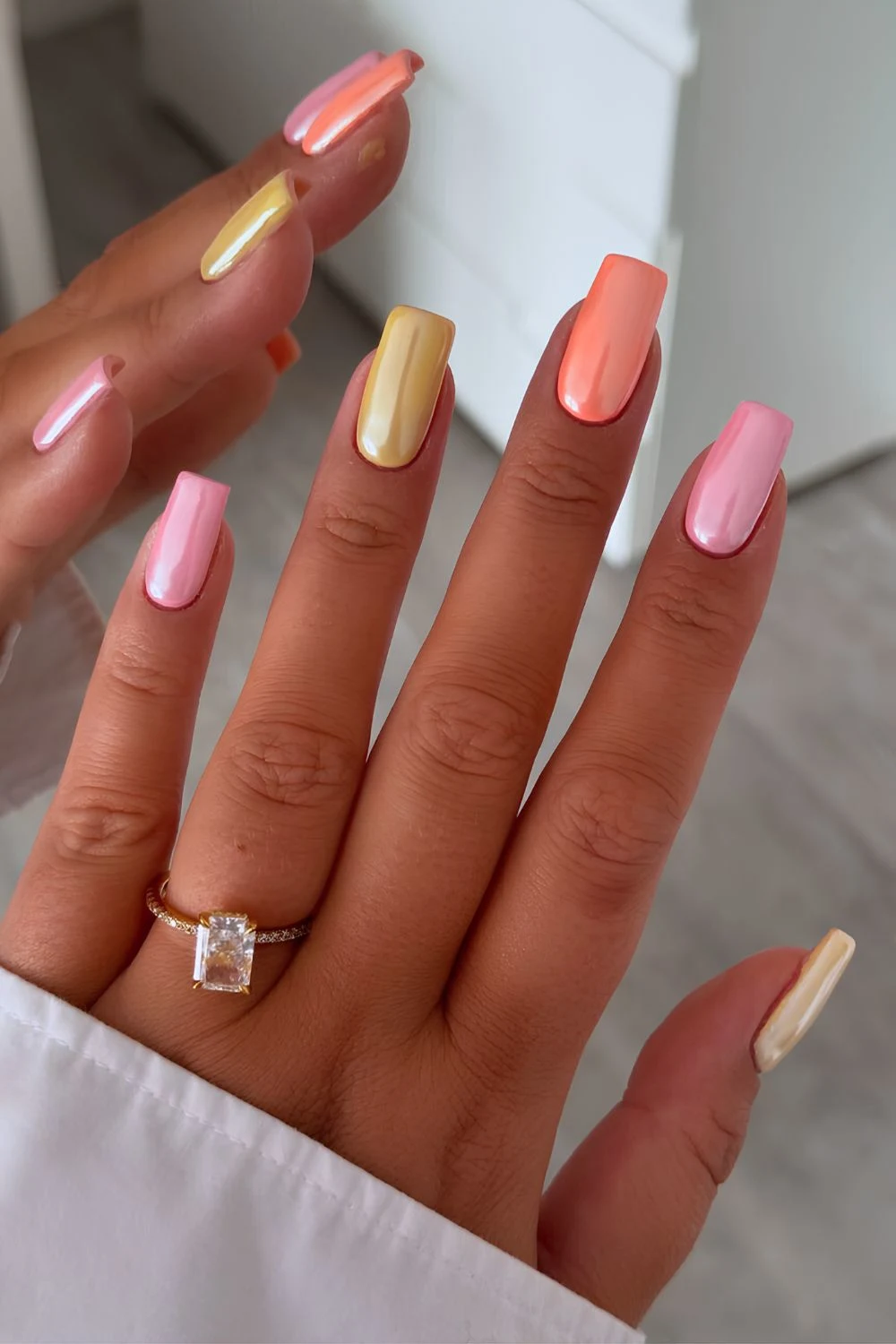 Pink yellow and orange chrome nails