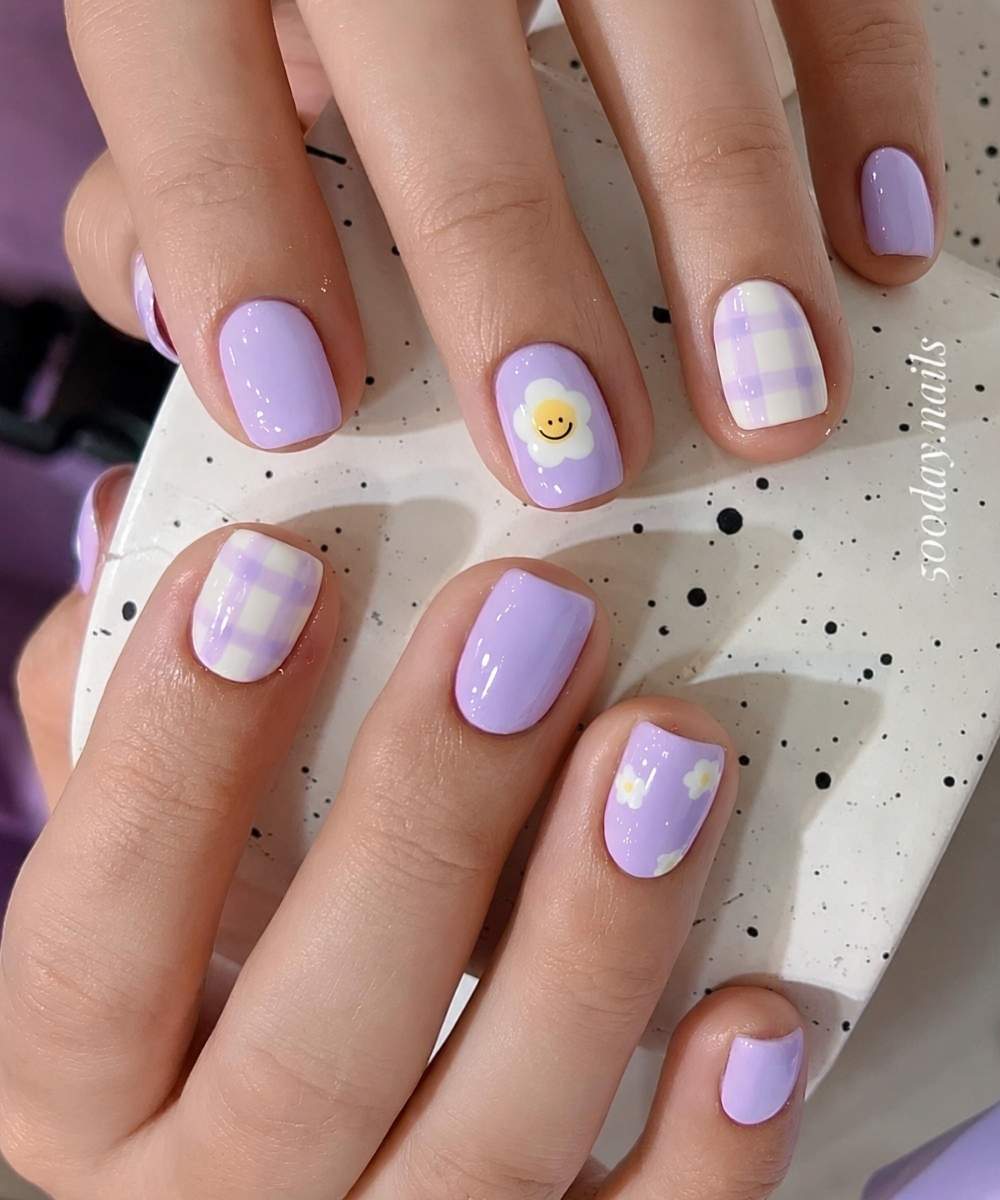 Purple nails with gingham and smiley florals