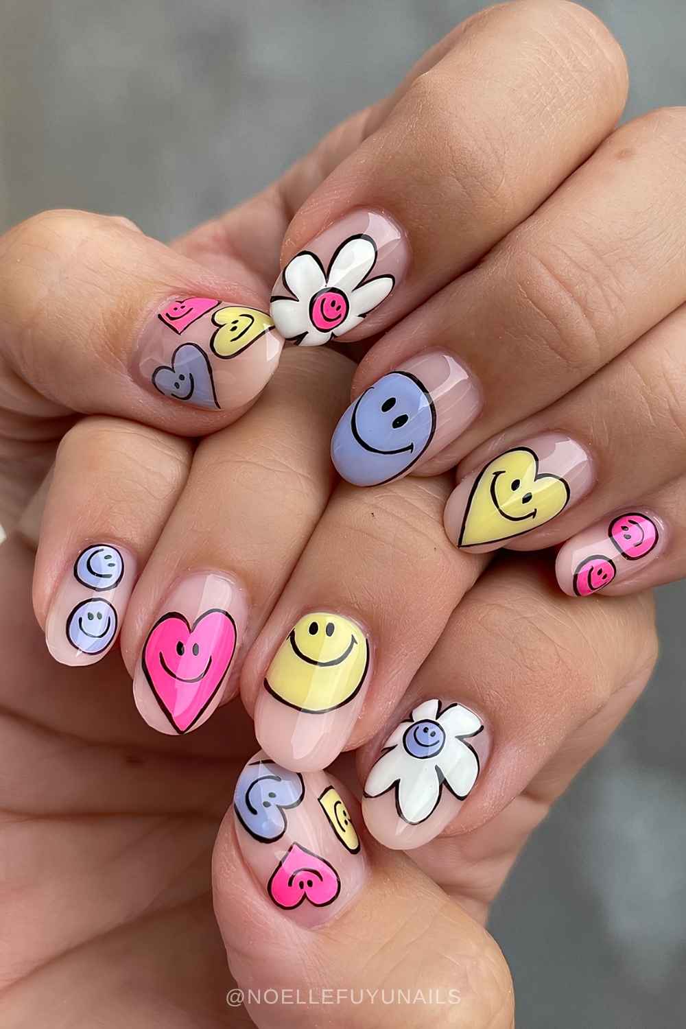 Sheer nails with cartoon style hearts and smileys