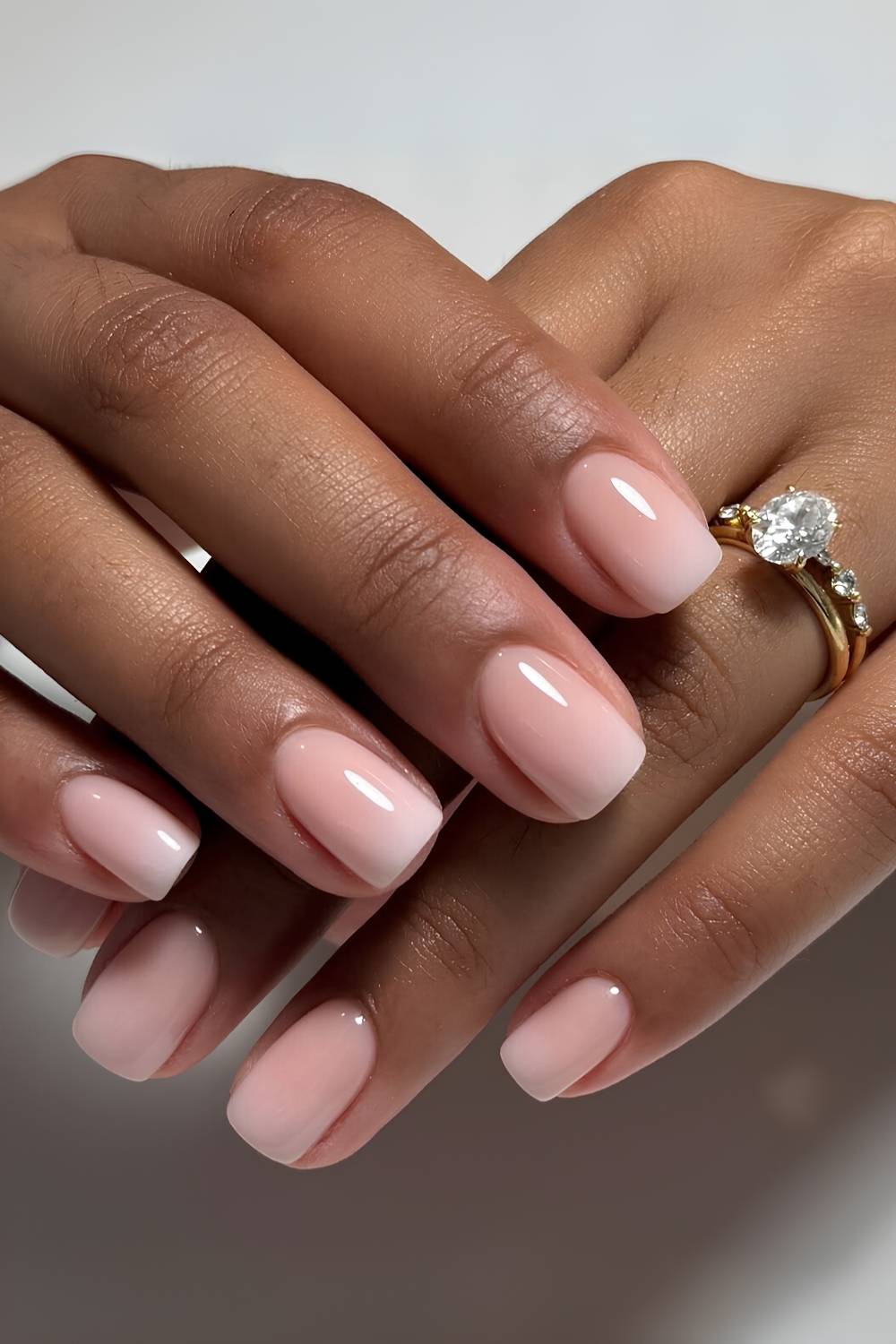 Short white to pink ombre nails