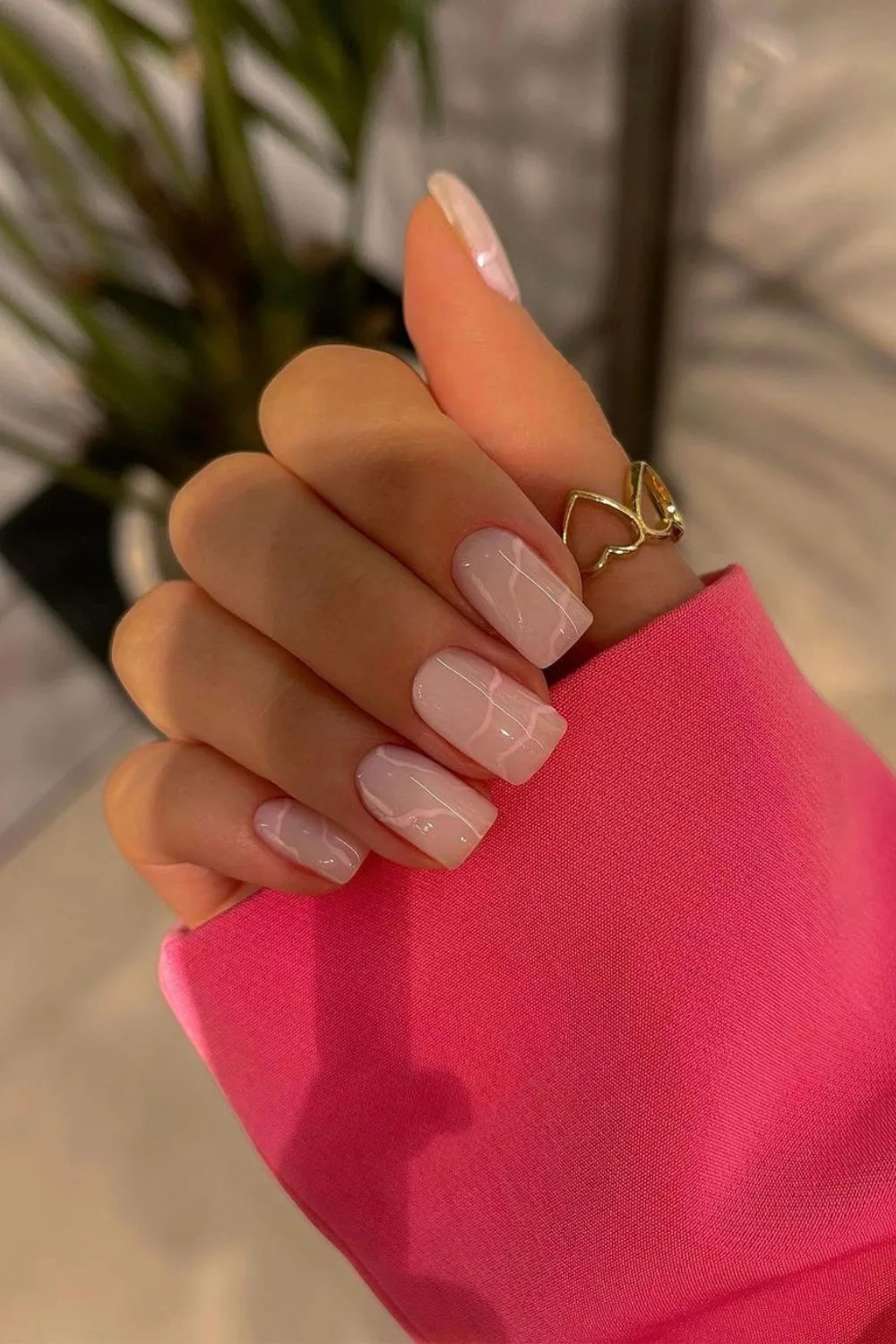 Soft pink marble-effect nails