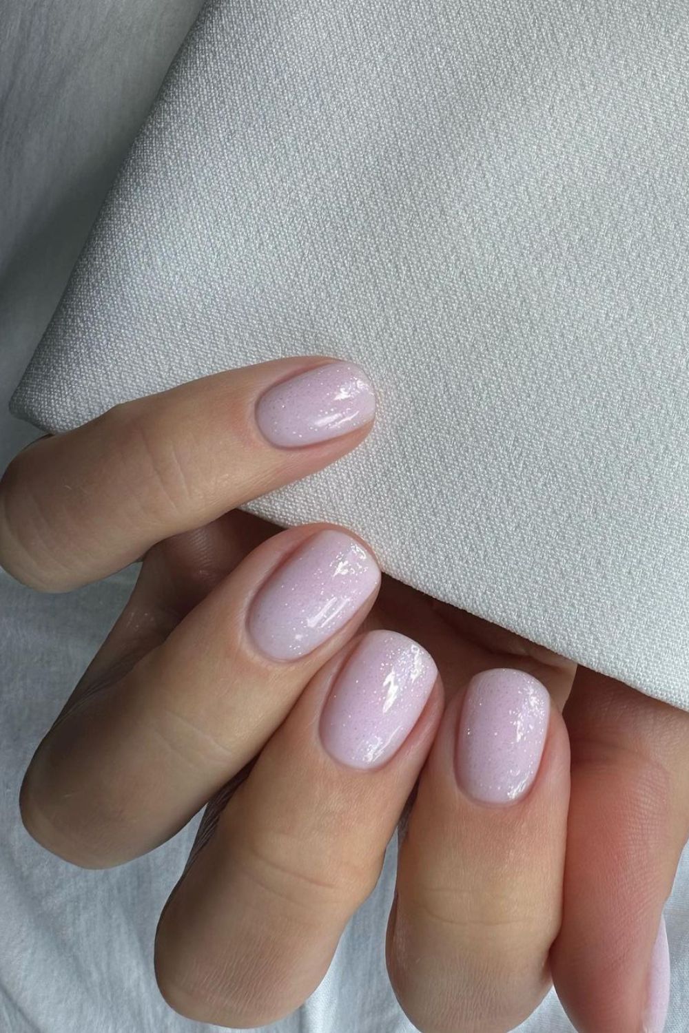 Soft pink nails with subtle glitter