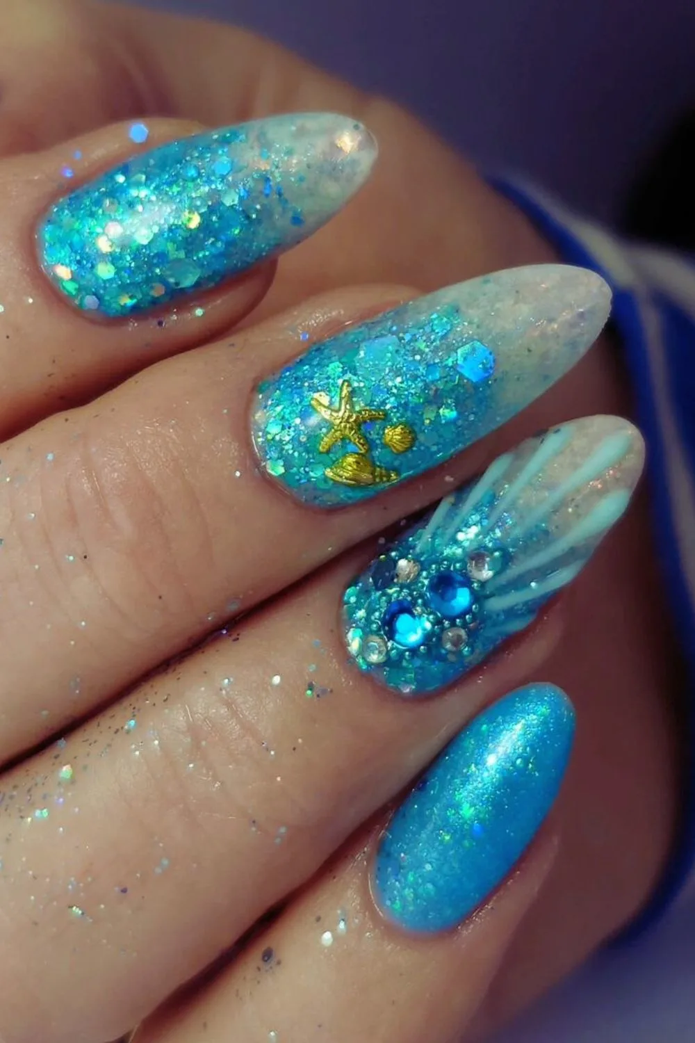 Sparkling blue nails with starfish details