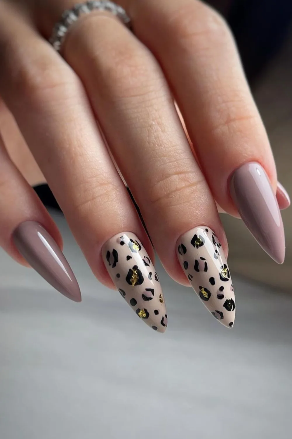 Taupe nails with gold leopard accents