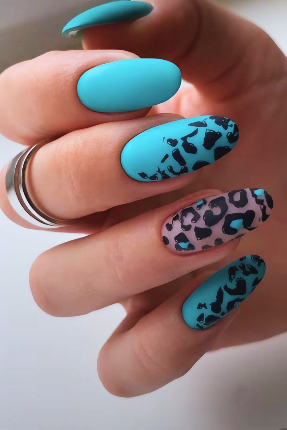 Turquoise nails with leopard accent