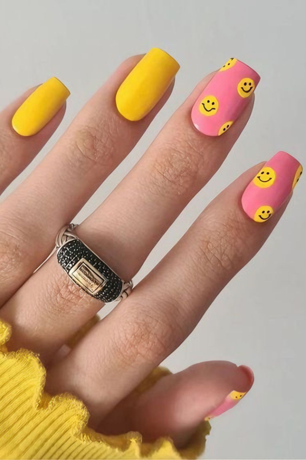 Yellow and pink smiley nails