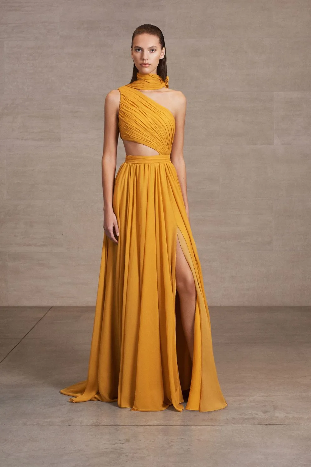 a model in a yellow stunning gown