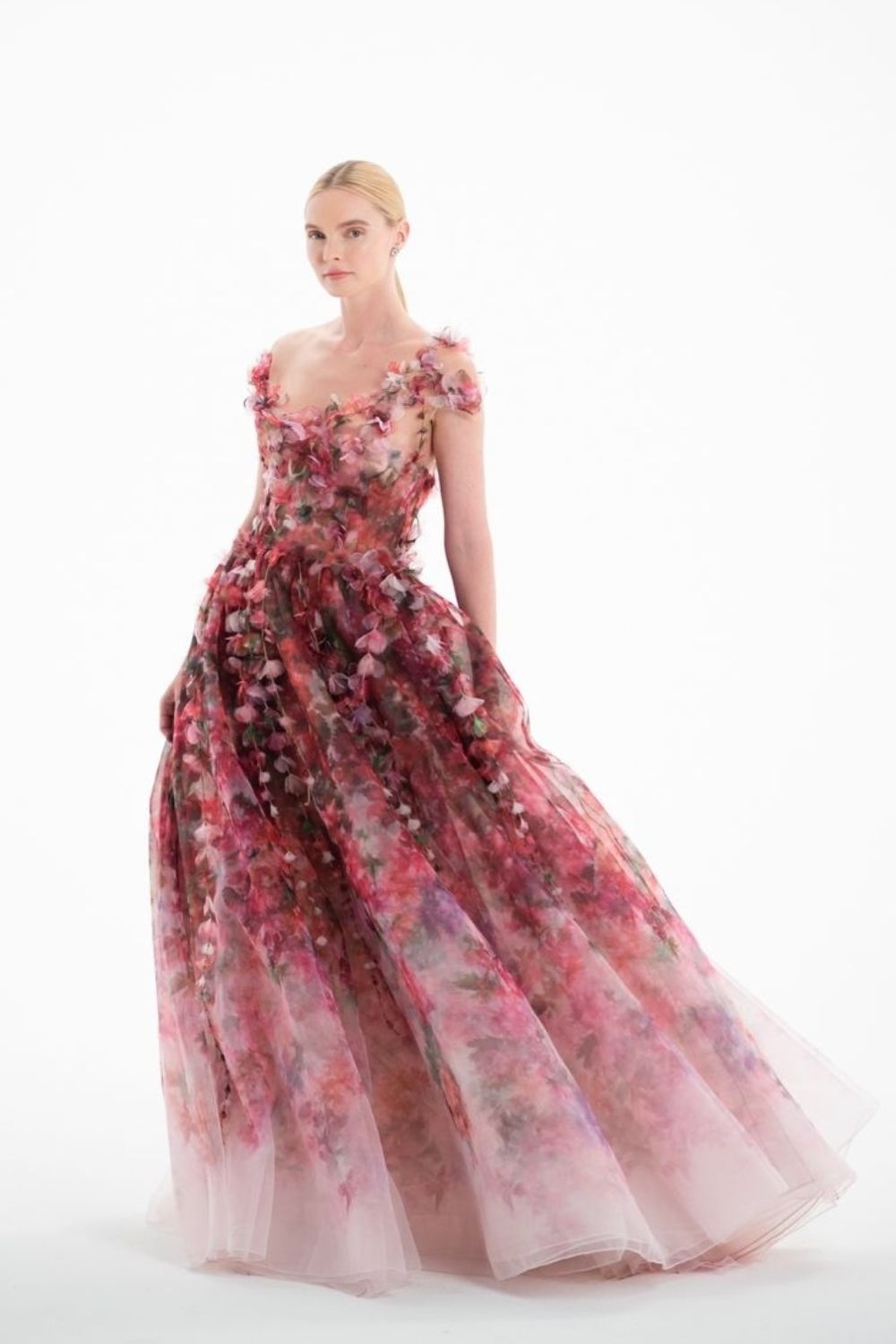 a model posing in princess floral dress