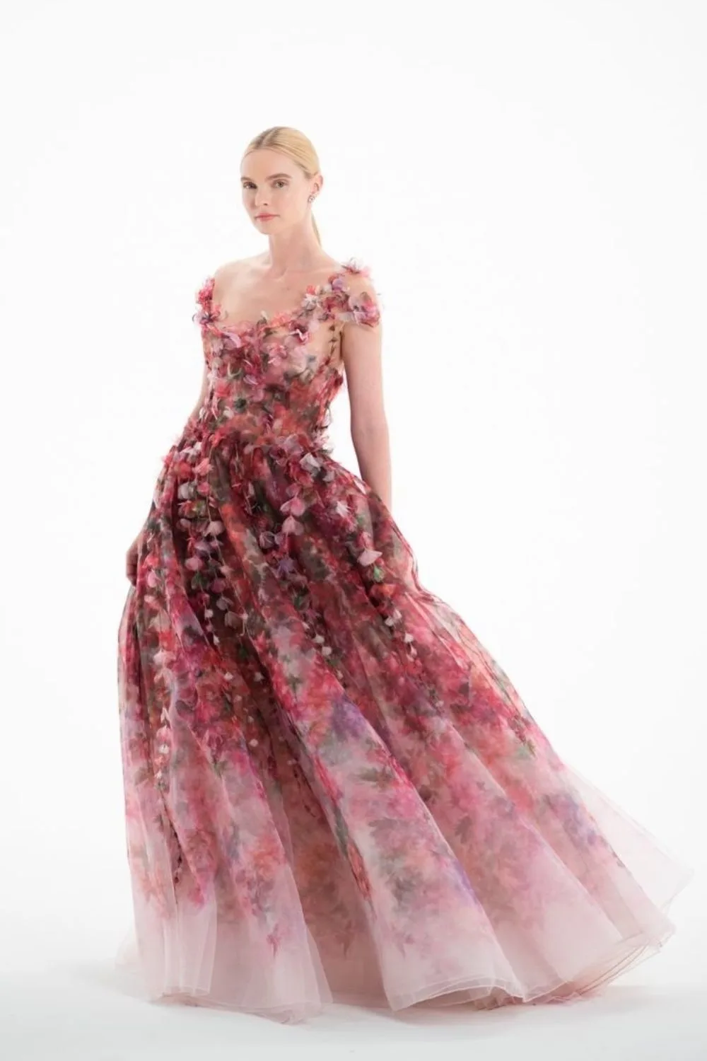 a model posing in princess floral dress