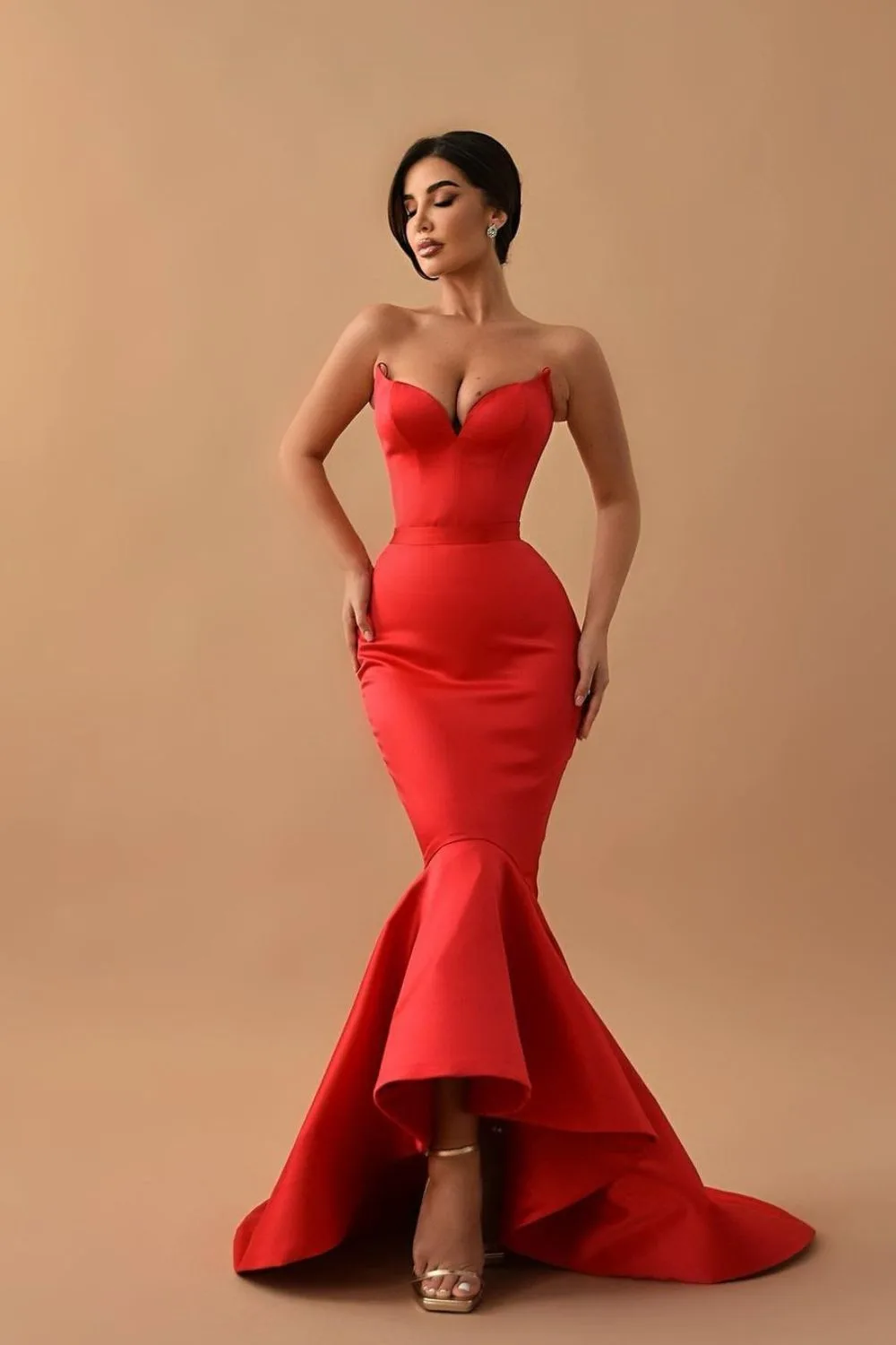 a model posing in red dress