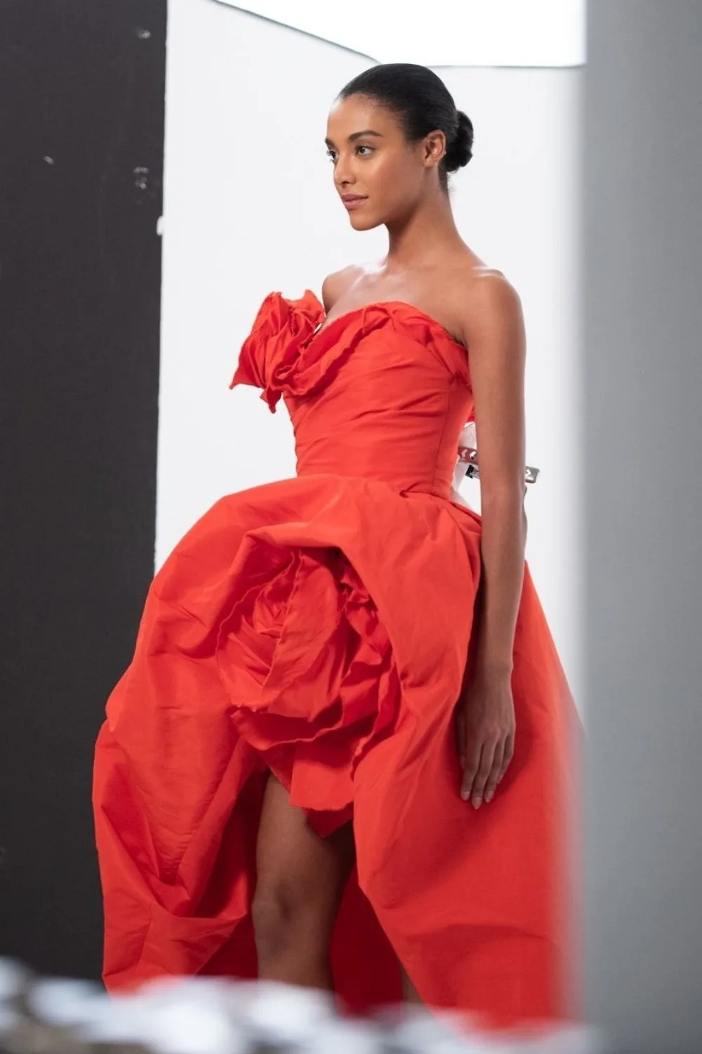 a model wearing red floral dress