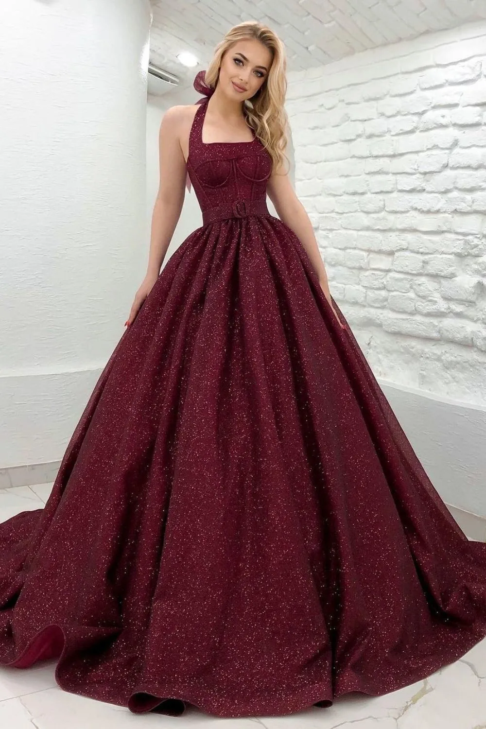 blond woman wearing princess dress in wine red