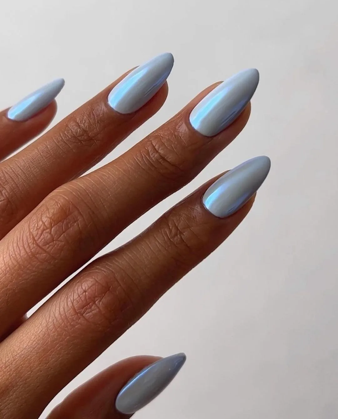 blue chrome nails with almond shape