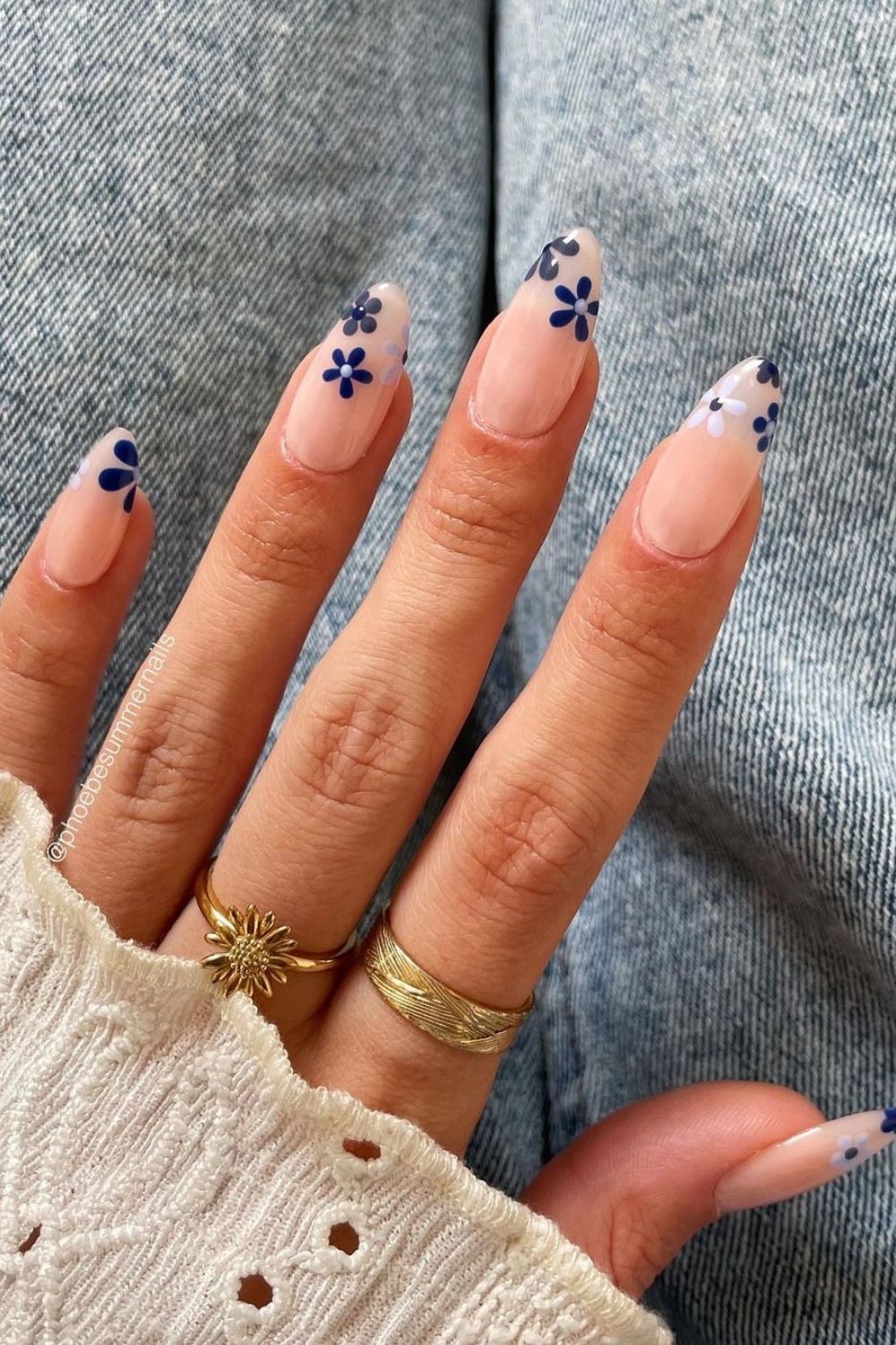 blue design on a milky almond nails