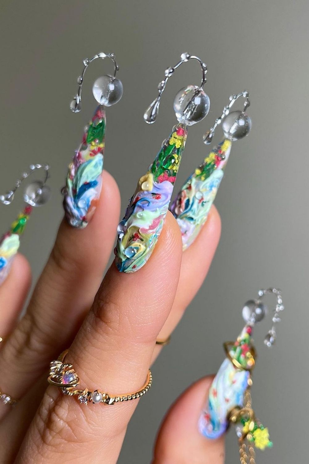 colorful 3d nails with ring on finger