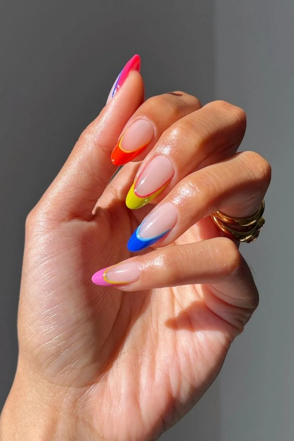 colorful lines on almond nails