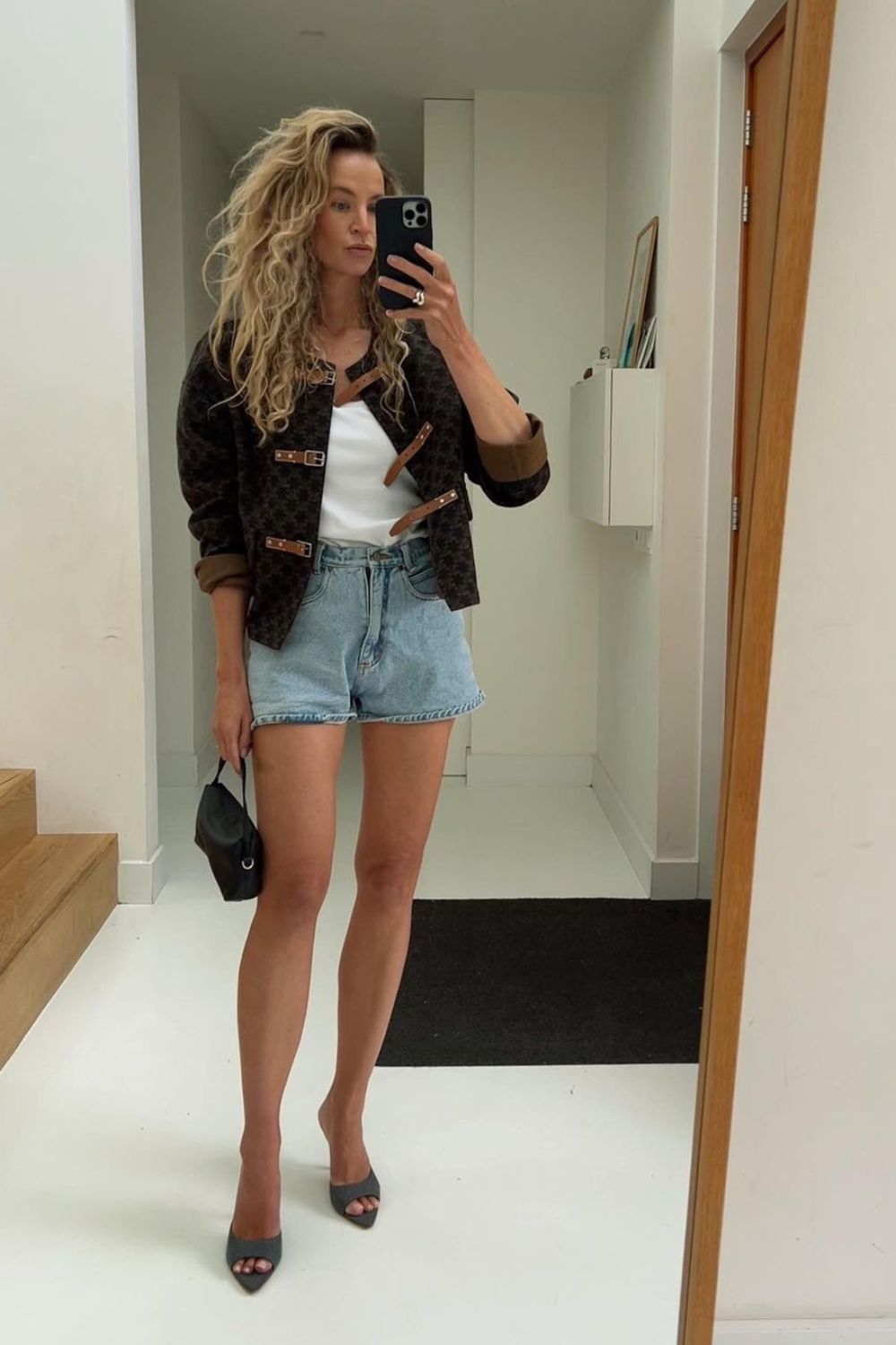 denim shorts and  black jacket outfit inspo