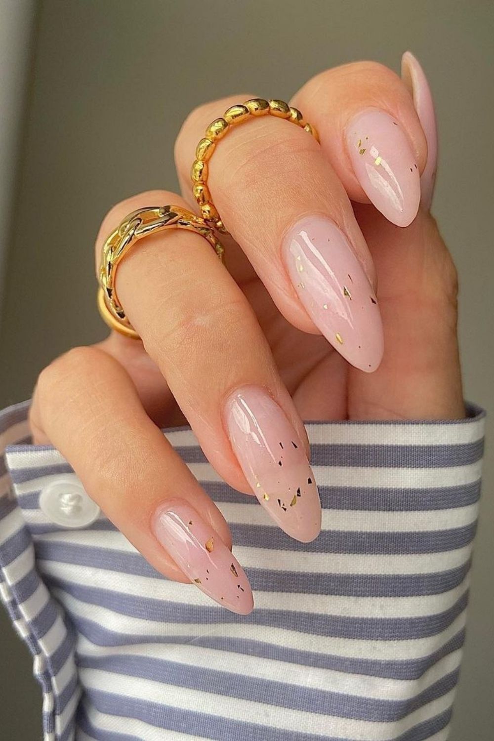 golden details on almond nails