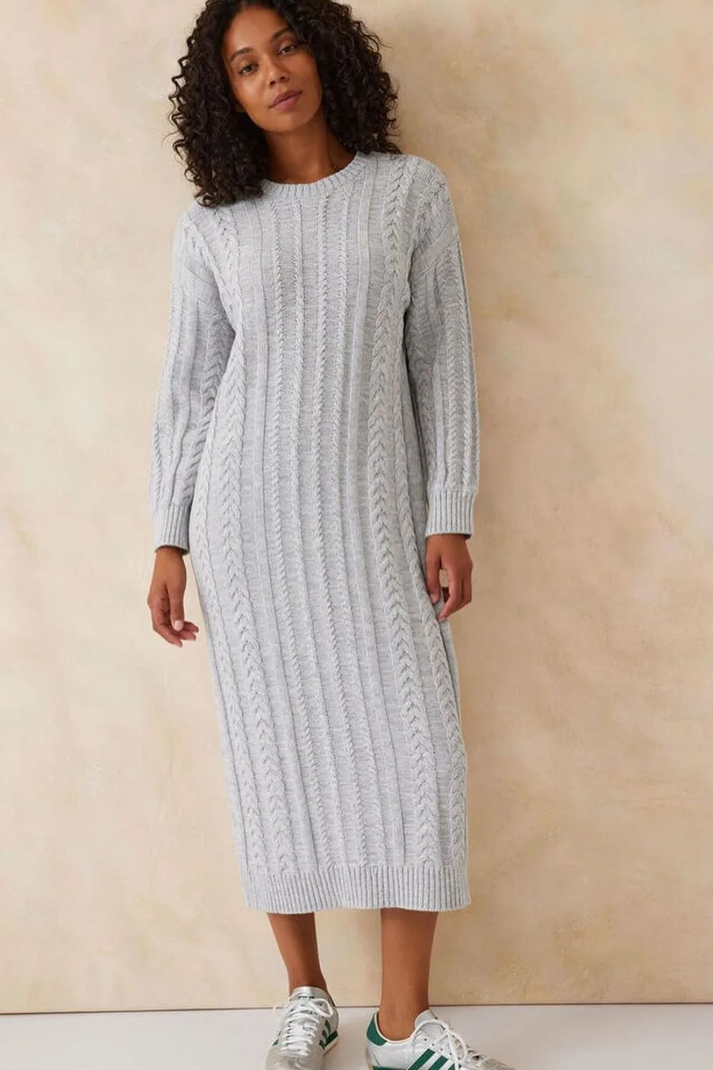 Woman wearing gray knitted dress