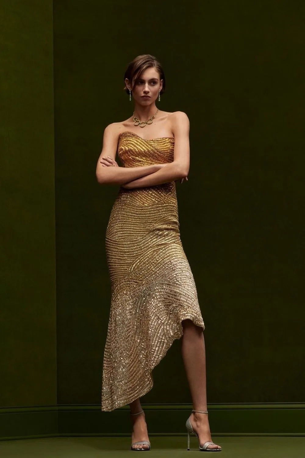 model posing in golden dress