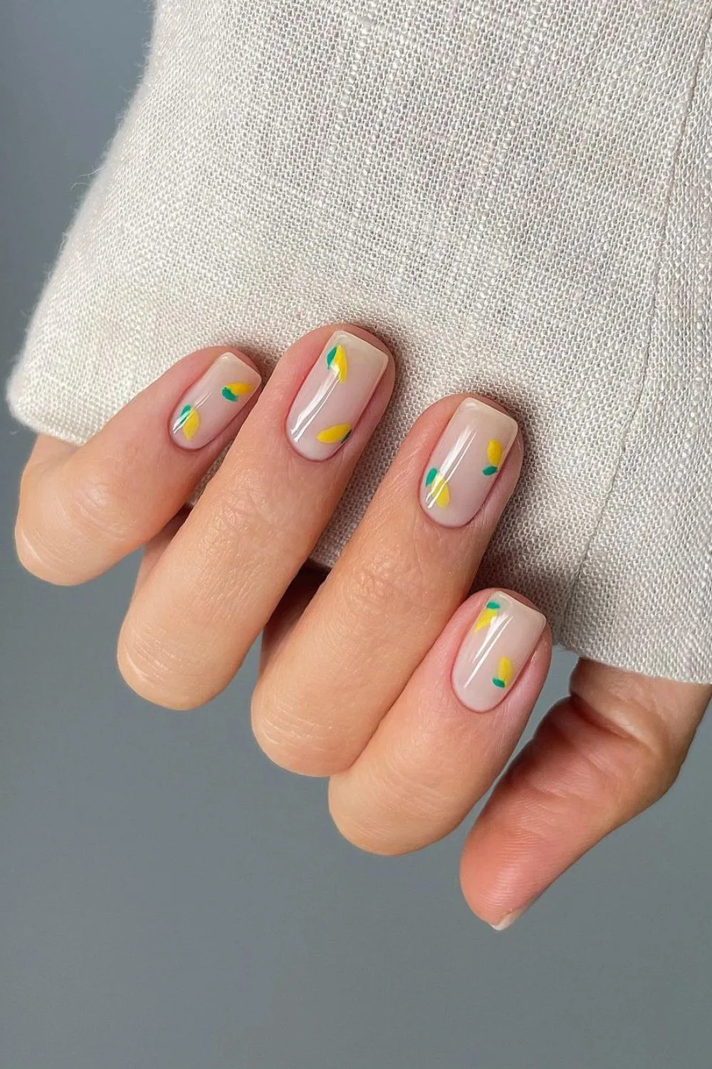 nude nails with yellow lemon details