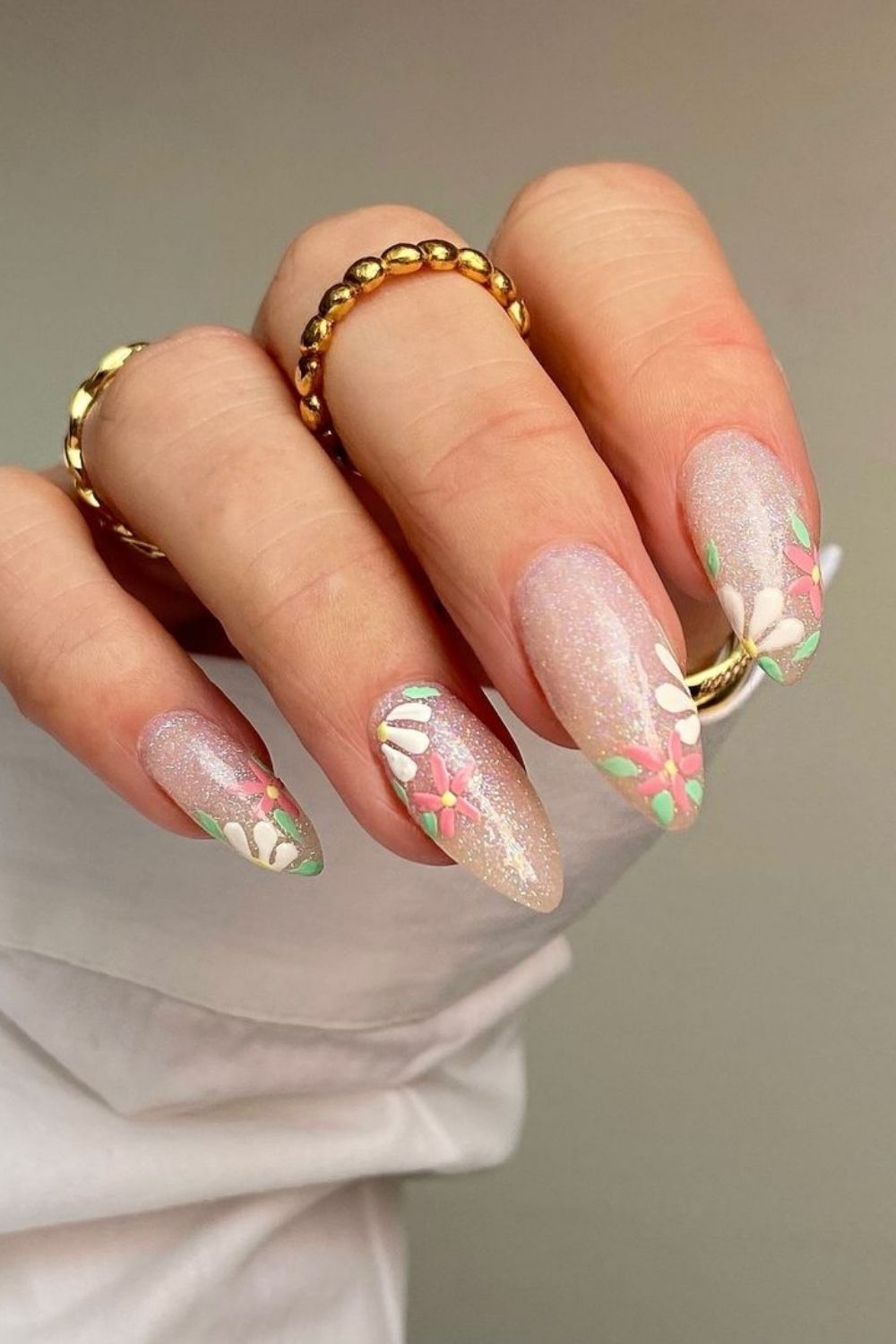 sparkly almond nails with flowers