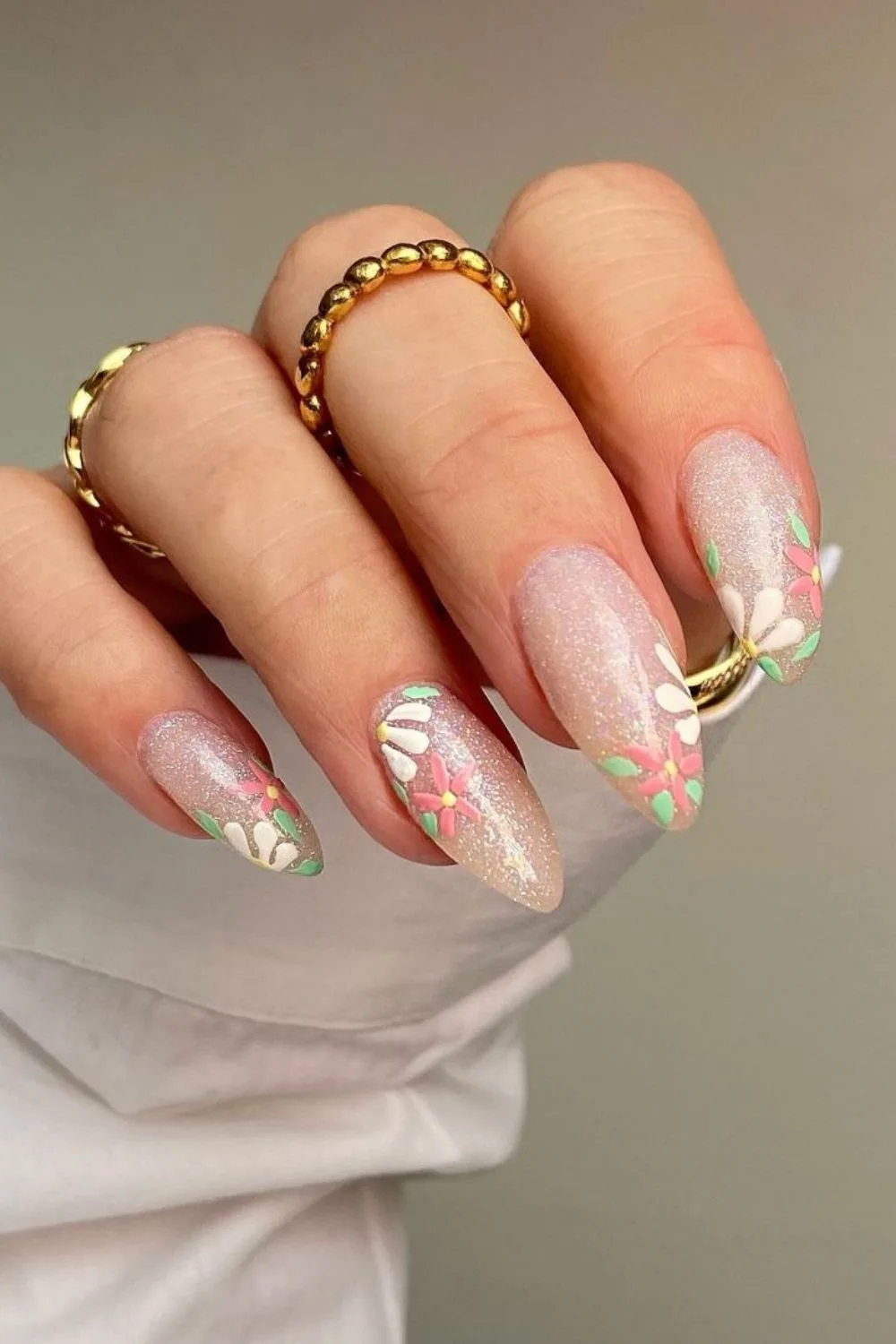 sparkly almond nails with flowers