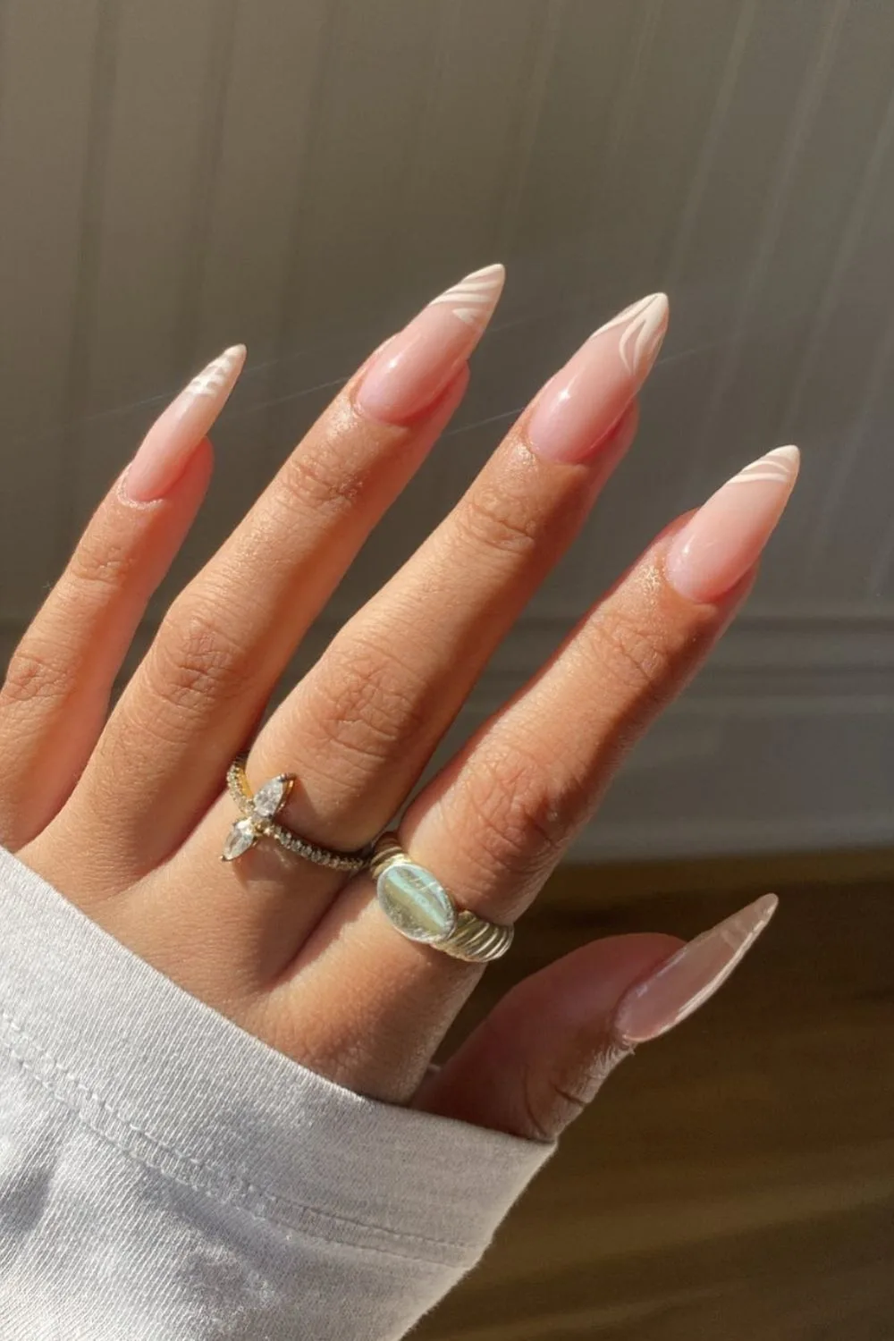 white design on almond nails